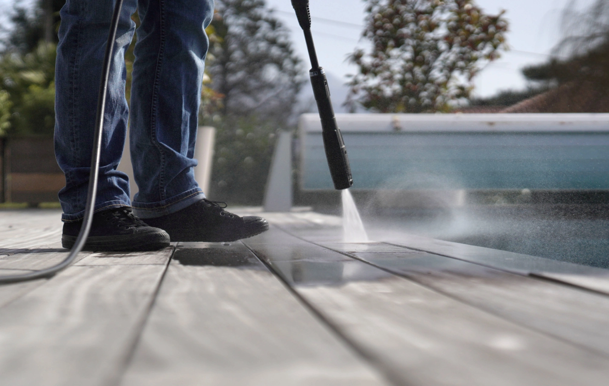 stock-photo-man-using-high-pressure-washer-cleaning-deck-1329974261