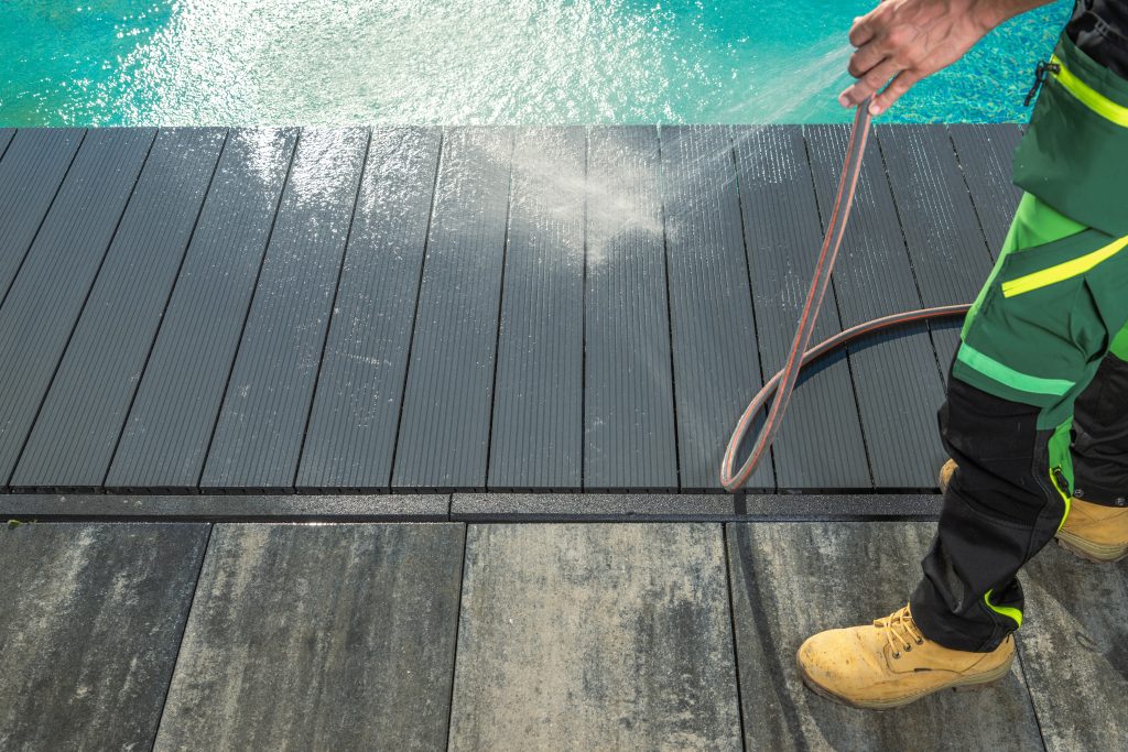 Men Pressure Washing Outdoor Swimming Pool Composite Deck.